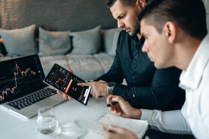 https://www.pexels.com/photo/man-in-black-long-sleeve-shirt-holding-black-tablet-computer-4960420/