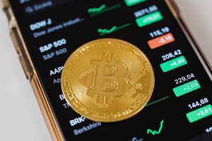 https://www.pexels.com/photo/gold-round-coin-on-top-of-a-cellphone-5980856/